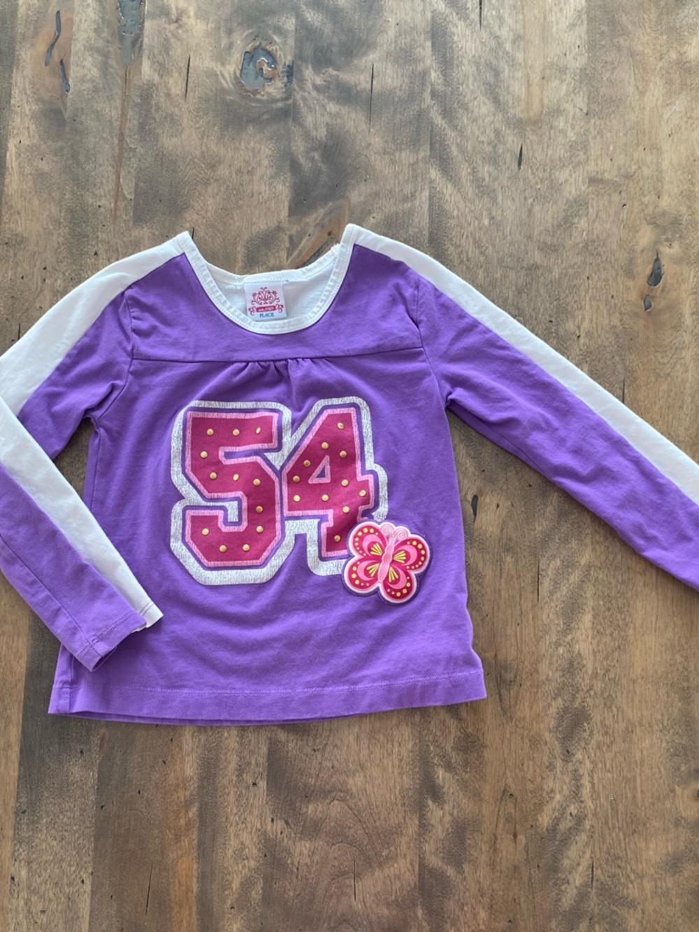 Place Purple Long-Sleeve Tee with White Sleeve Stripes and Pink Number 54
